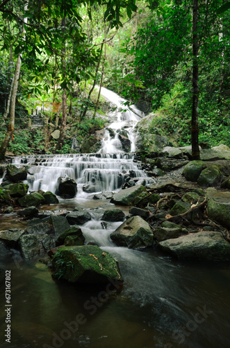 landscape of waterfall in vertical view in rainforest of thailand