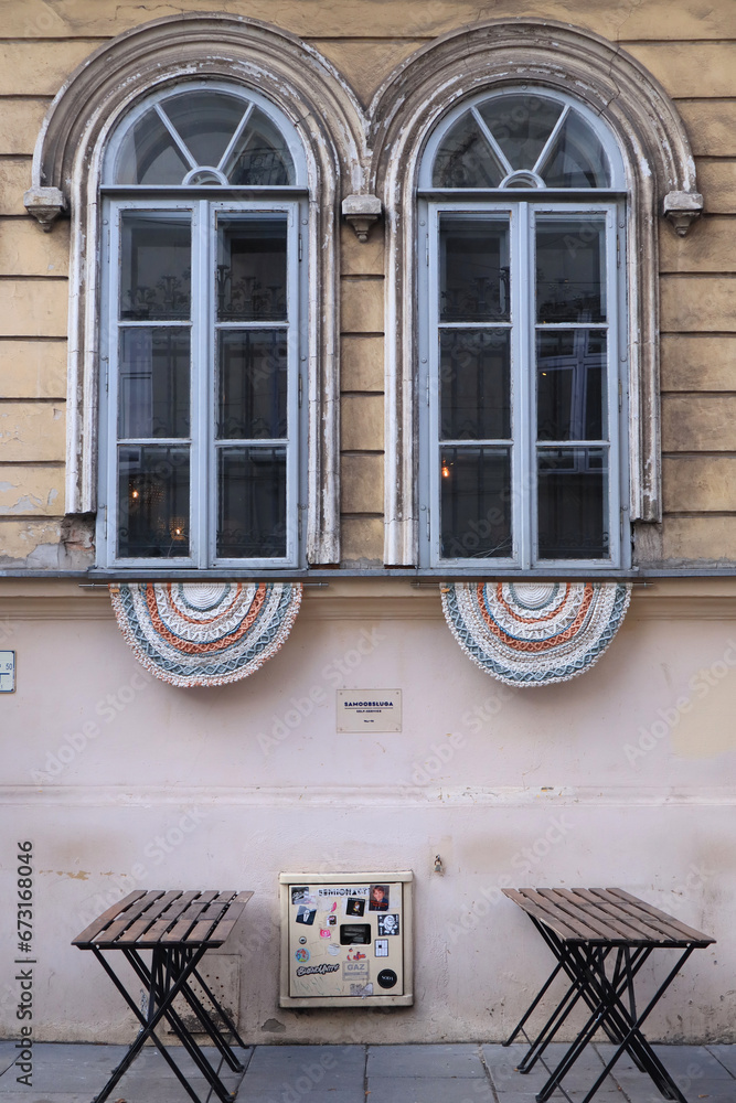 Antique semi-circular windows decorated with woven macramé laces