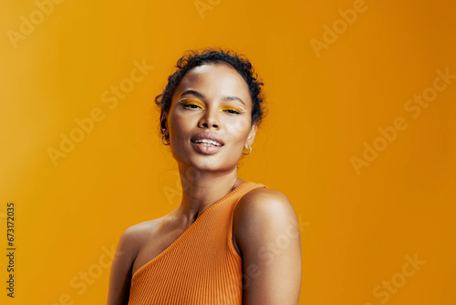 Smile woman face african colourful portrait creative beautiful black yellow make-up beauty