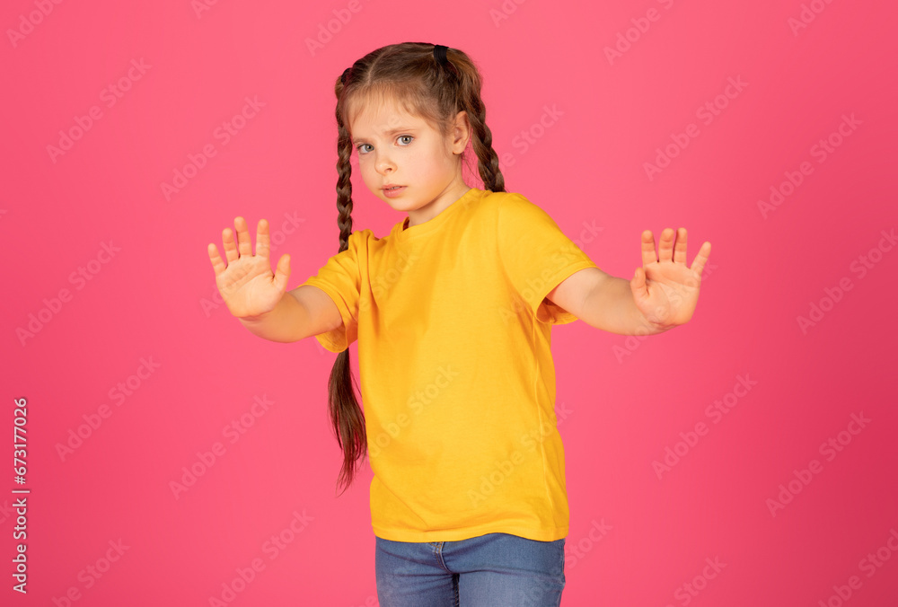 Scared Little Girl Showing Stop Gesture With Hands And Looking At Camera Scared Little Girl Showing Stop Gesture With Hands And Looking At Camera