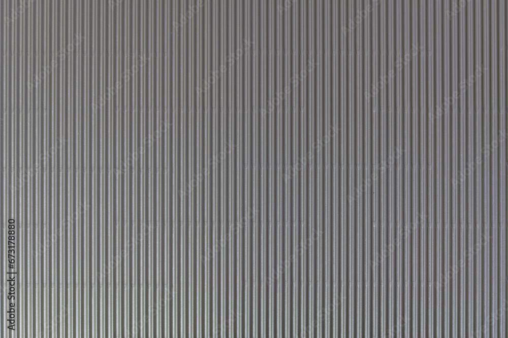 The texture of corrugated cardboard craft paper - grey. Grey corrugated cardboard useful as a background and texture. The texture of corrugated cardboard craft paper - grey. Grey corrugated cardboard useful as a background and texture.