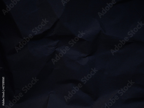 Black Crumpled paper texture. Design material. Copy space. creased effect