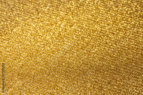 The texture of corrugated cardboard craft paper - gold. Gold corrugated cardboard useful as a background and texture. photo