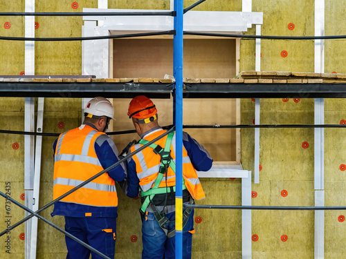 Builders at work. Men at co...
