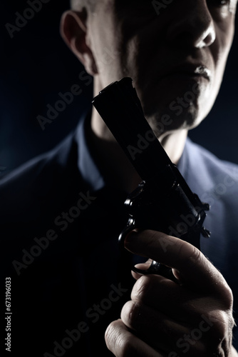 Assasin spy killer with handgun pistol