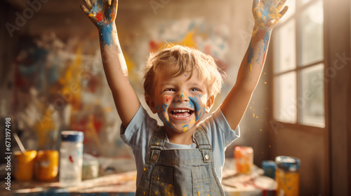 A delighted little boy, radiating extreme happiness after his art painting class, with paint adorning his hands and face