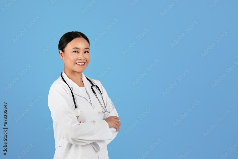 Healthcare Professional. Cheerful Asian Woman Doctor In White Lab Coat With Stethoscope Healthcare Professional. Cheerful Asian Woman Doctor In White Lab Coat With Stethoscope