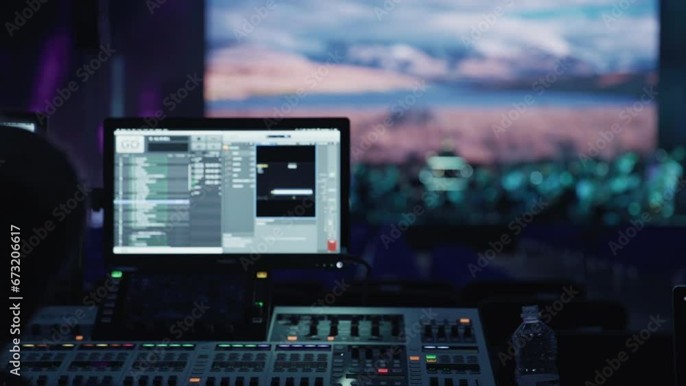 Backstage control room. Control panel with computer screen displaying ...
