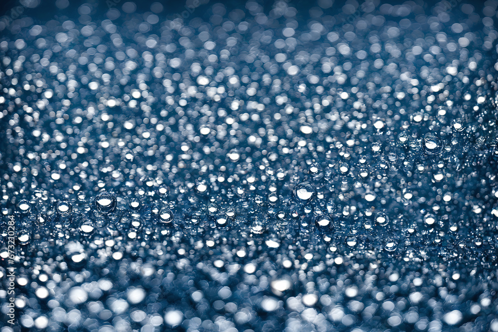 Texture from water drops. Bright light falls on water drops with beautiful bokeh in the background Texture from water drops. Bright light falls on water drops with beautiful bokeh in the background
