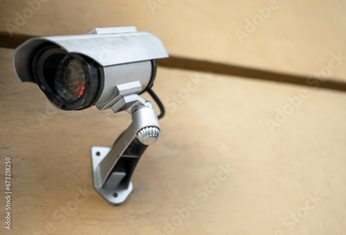 Surveillance Video camera on wall controlling entrance to house or office