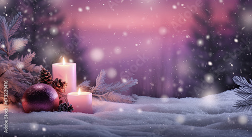 velas de navidad encendidas junto bolas y piñas sobre paisaje natural de bosque nevando y fondo desenfocado morado photo