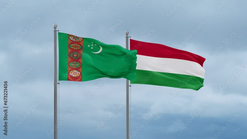 Hungary flag and Turkmenistan flag waving together on cloudy sky, endless seamless loop, two country relations concept Hungary flag and Turkmenistan flag waving together on cloudy sky, endless seamless loop, two country relations concept