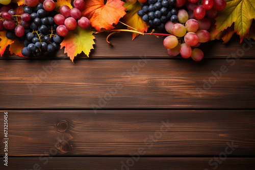 Autumn background with fruits, berries and leaves on dark wooden backgroundAutumn background with fruits, berries and leaves on dark wooden backgroundAutumn background with fruits, berries and leaves  photo