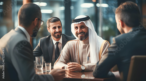 Multi-racial business meeting between a successful Arab investor and business people in an office. photo