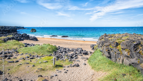 The coastline at Skardsvik beach in the northern side of Snaefellsnes peninsula, western Iceland. Skardsvik Beach in summer photo