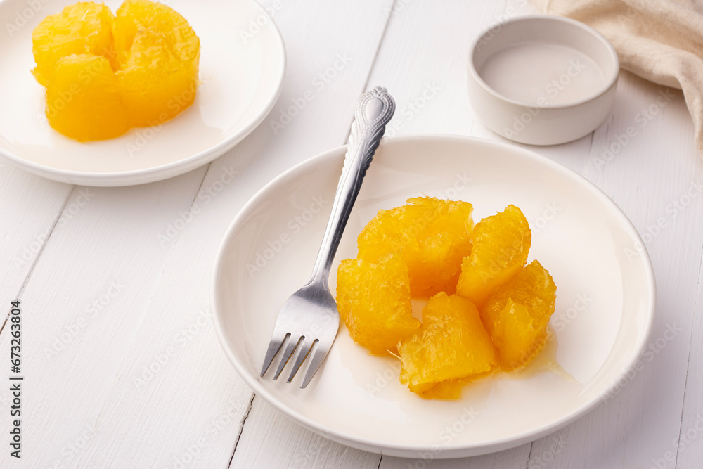 Sweet Cassava or Tapioca in heavy Syrup topped with coconut milk on a plate,sweetened thai snack food Sweet Cassava or Tapioca in heavy Syrup topped with coconut milk on a plate,sweetened thai snack food