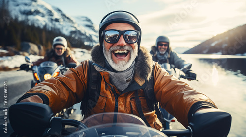 Portrait of happy confident senior motorcyclists travels through the Norwegian fjords. Concept of active age