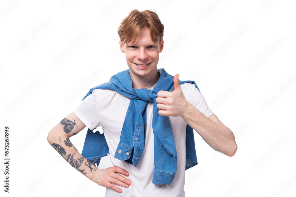 portrait of a young stylish fashionable european man with red hair and a tattoo on his arms showing class portrait of a young stylish fashionable european man with red hair and a tattoo on his arms showing class
