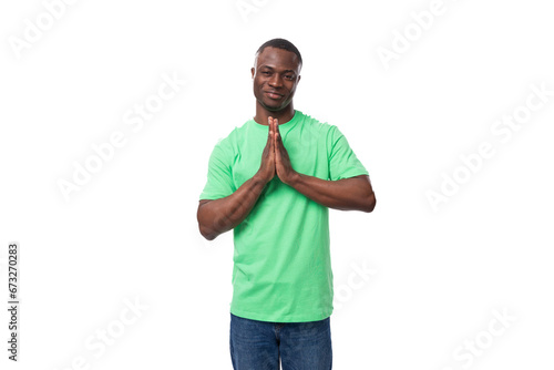 young american man in casual t-shirt thinking over white background
