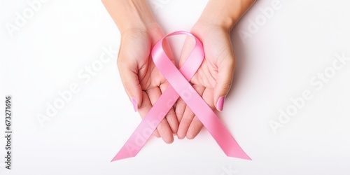 Wallpaper Mural Woman hands holding pink ribbon over transparent white background, breast cancer awareness, cancer awareness day Torontodigital.ca