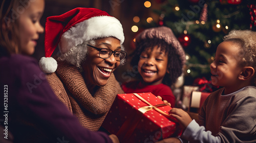 Afro-American grand mother with her kids celebrating christmas