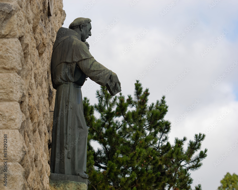Naklejka premium Statue of Saint Anthony of Padua above the entrance of the church of Saint Anthony of Padua, Sveti Duh, Zagreb, Croatia