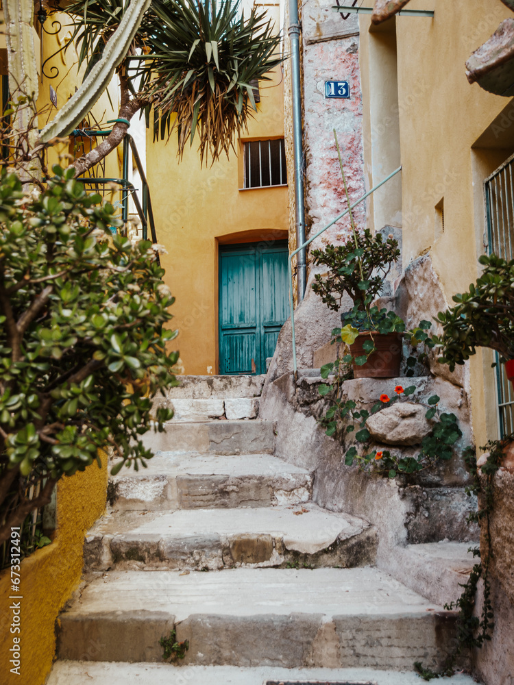 Obraz premium Streets of Menton, Cote D'azur, France with a blue door