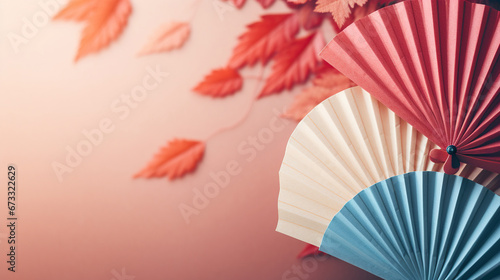 Traditional Japanese fan with red autumn leaves  fall vibes background