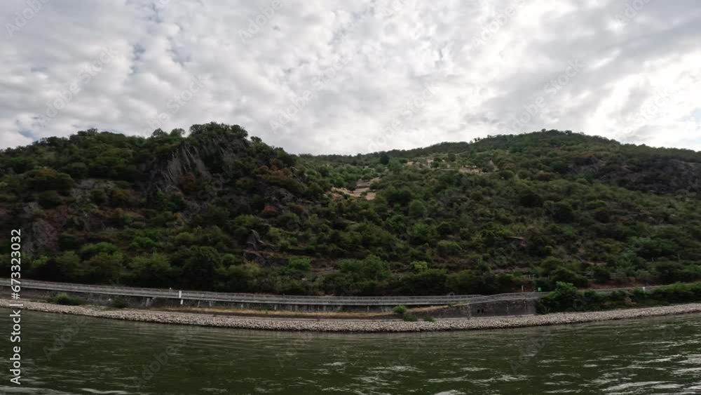 Cruising along the Rhine River with stunning views of the German medieval towns and villages and green landscapes and mountains. Cruising along the Rhine River with stunning views of the German medieval towns and villages and green landscapes and mountains.