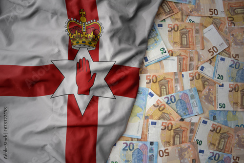 colorful waving national flag of northern ireland on a euro money background. finance concept photo