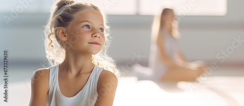 Artistic depiction of a young child engaging in physical movements as part of a collective session held within a dance facility