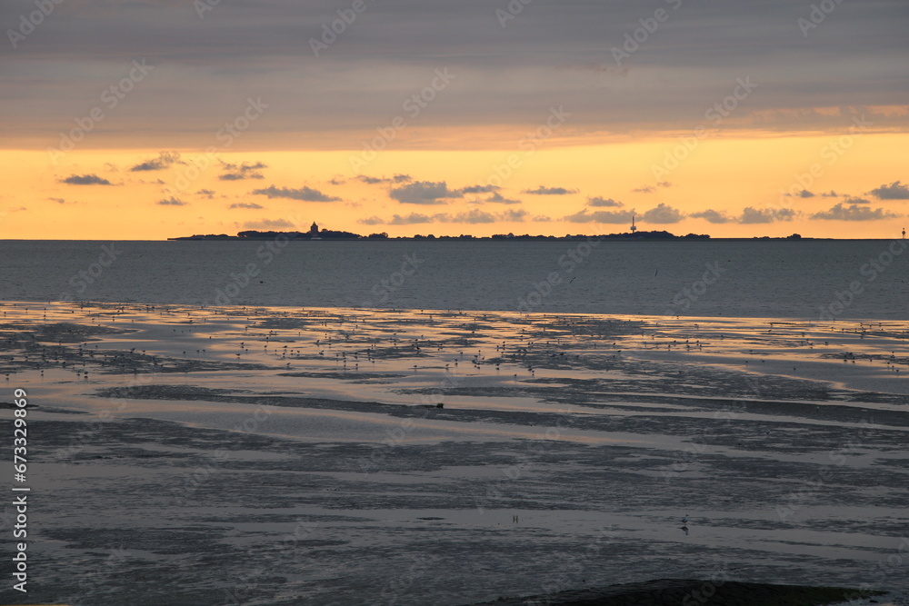 Silhouette of the island of Neuwerk at sunset | As seen form Cuxhaven-Duhnen