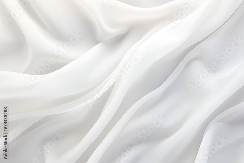white fabric lies in soft waves as a background, top view. material.