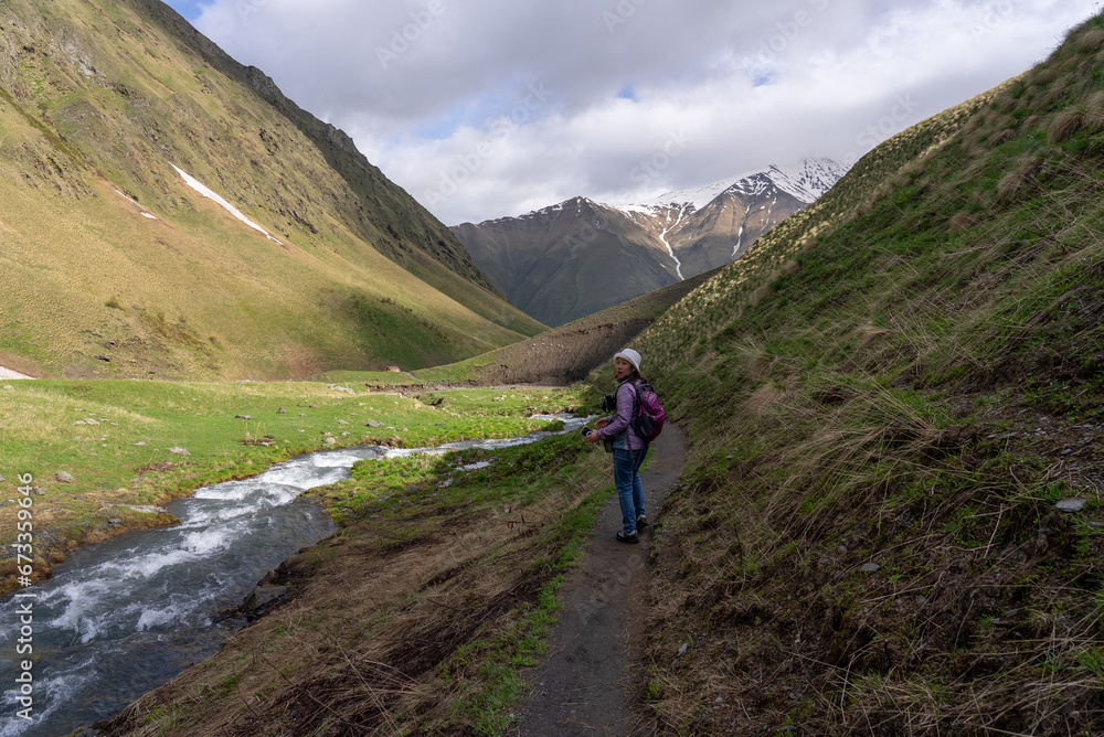 Asian Woman Trekking on Beautiful Trail in Juta Georgia in Summer