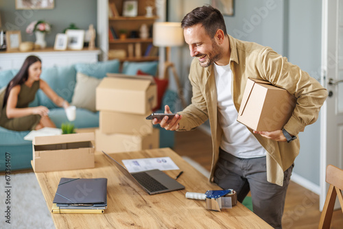 Small business owner packing in the cardbox at workplace