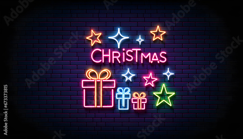 Neon sign with the word "Christmas" and holiday symbols