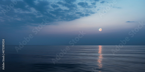 Full moon rising over ocean  calm waters  soft clouds  misty air  ethereal lighting  soothing atmosphere