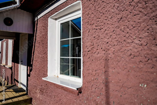 Window of an old house  entrance  facade.