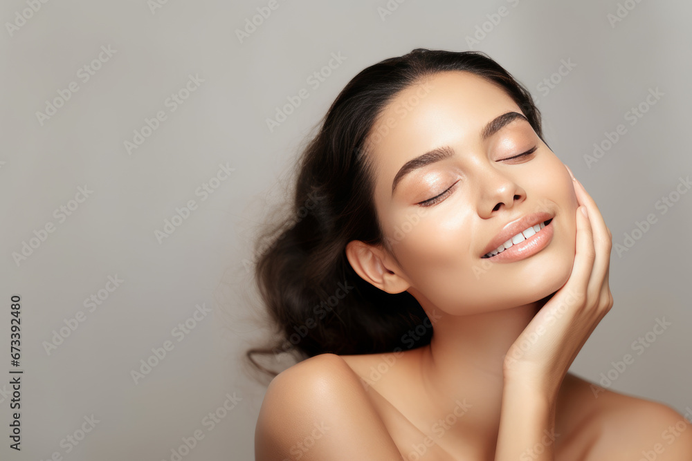 Beautiful Young Woman with Clean Fresh Skin touch own face . Facial treatment . Cosmetology , beauty and spa Beautiful Young Woman with Clean Fresh Skin touch own face . Facial treatment . Cosmetology , beauty and spa