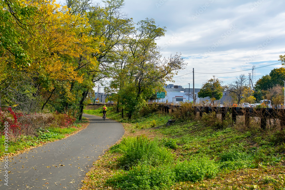 Separated bike lane along the main road on an autumn day in Watertown, MA, USA Separated bike lane along the main road on an autumn day in Watertown, MA, USA