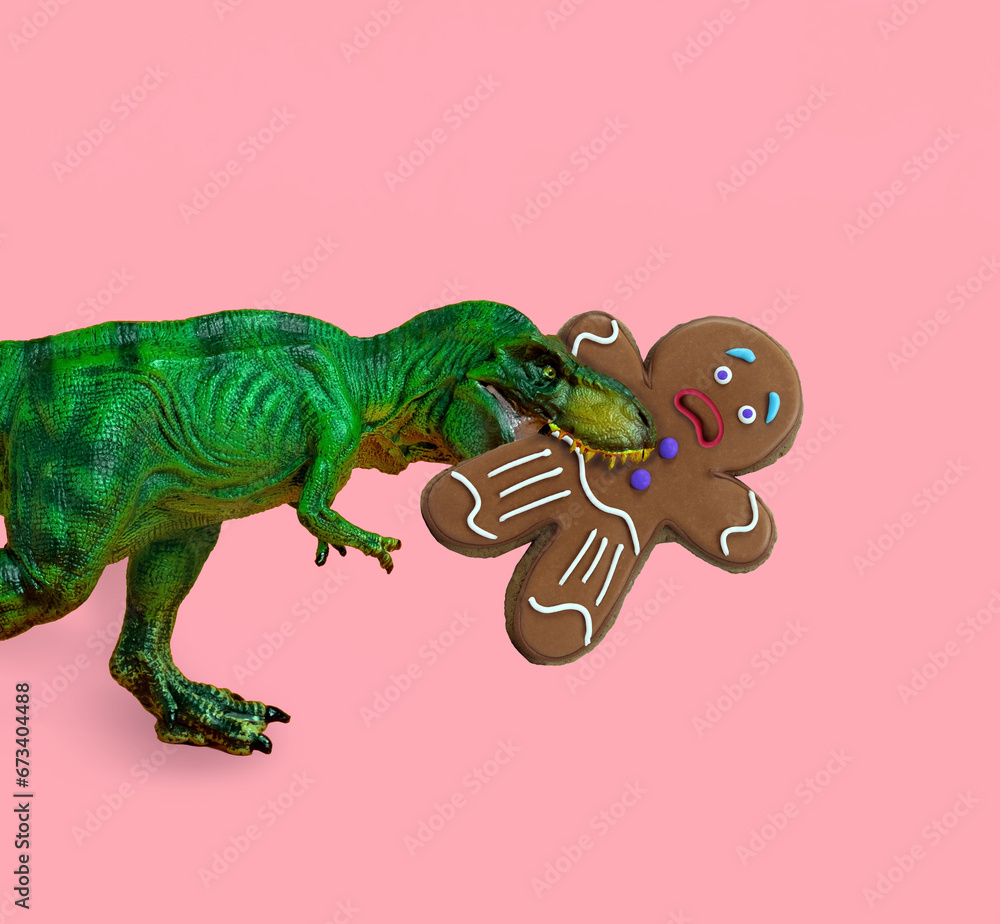Fototapeta premium Big green dinosaur eats ginger man. Funny Christmas card.