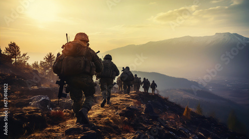 Heavy armed Soldiers getting on position. Group walking against of sunset. War concept  photo