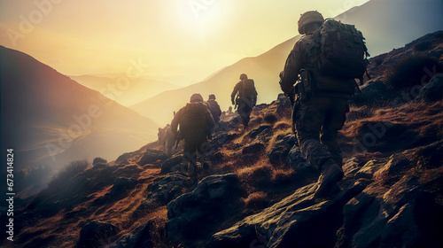 Heavy armed Soldiers getting on position. Group walking against of sunset. War concept  photo
