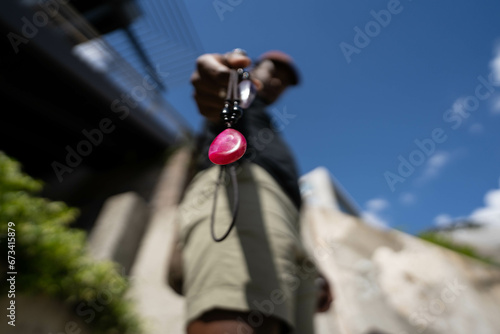Holding necklace