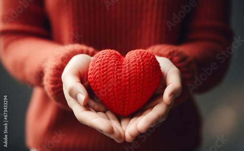 Hands close up holding red heart