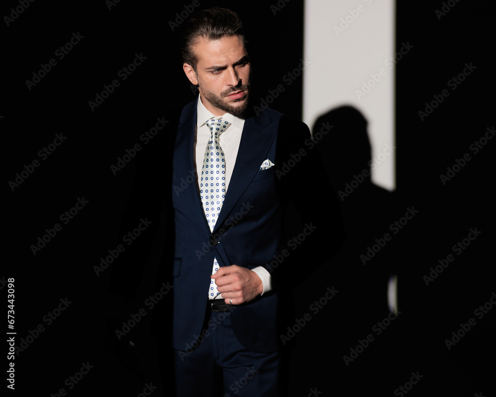 fashion high class businessman in suit looking to side and posing fashion high class businessman in suit looking to side and posing