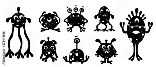 Set of silhouettes of small funny monsters.Vector graphics.