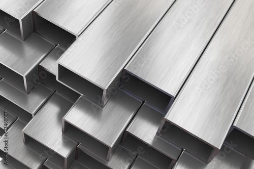 Aluminium or steel profiles for windows manufacturing. Stack of aluminium or steel profiles in warehouse.
