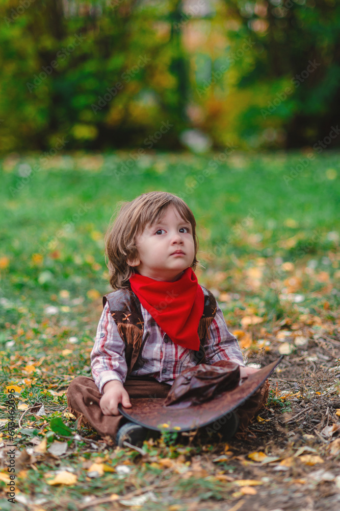 Little cowboy in the autumn field Little cowboy in the autumn field