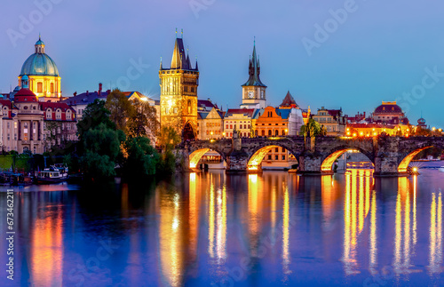 Prague cityscape with Charles bridge over Vltava river at night, Czech Republic